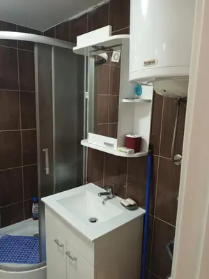 a bathroom with a sink and a toilet and a tub at Jelena Lux in Vrnjačka Banja