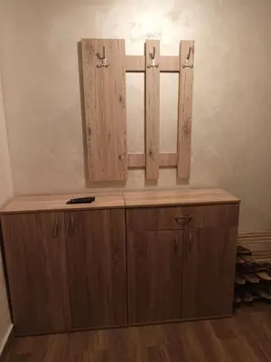 a wooden cabinet with a mirror on top of it at Jelena Lux in Vrnjačka Banja