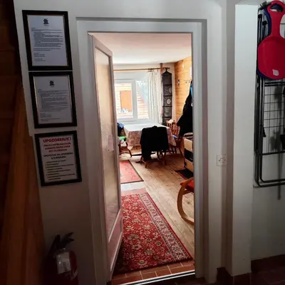 a hallway with a door leading to a living room at Kuća Drinčić in Kopaonik