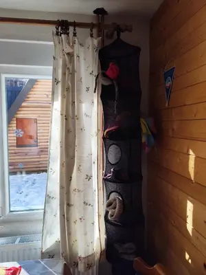 a curtain in a room next to a window at Kuća Drinčić in Kopaonik