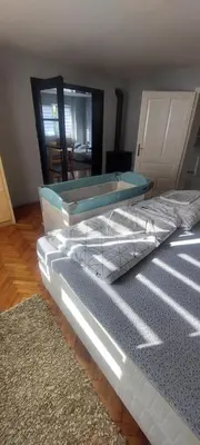 a bedroom with a bed with a tray on it at Apartman VRANJANKA in Vranje
