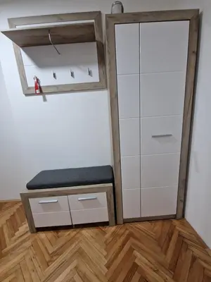 a dressing room with a mirror and a bench at Apartman DRINA in Vranje