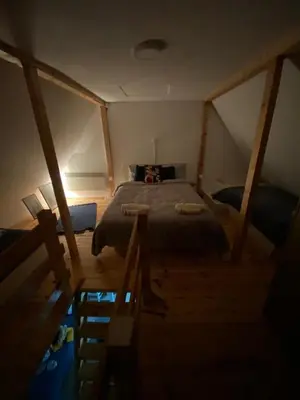 a bedroom with a large bed in a attic at Casa Vidica in Kopaonik