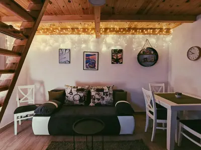 a living room with a couch and a table at Casa Vidica in Kopaonik
