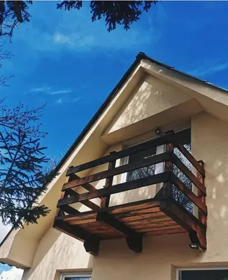 a balcony on the side of a building at Casa Vidica in Kopaonik