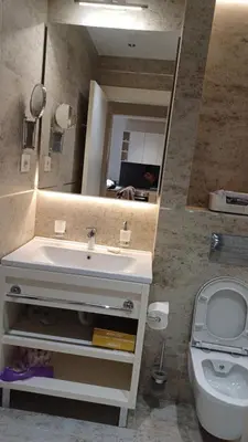 a bathroom with a sink and a toilet and a mirror at Zepterme 511 in Vrnjačka Banja