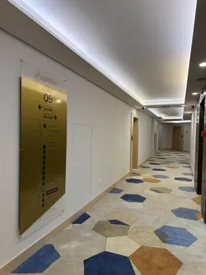 a hallway with a tile floor in a building at Zepterme 511 in Vrnjačka Banja