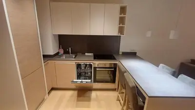 a small kitchen with a stove and a sink at Zepterme 511 in Vrnjačka Banja