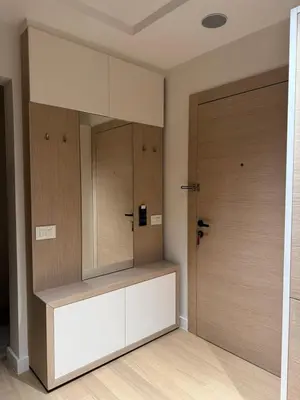 a dressing room with a mirror and a door at Zepterme 511 in Vrnjačka Banja