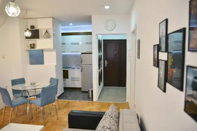 a living room with a couch and a table at Heart of the city in Niš