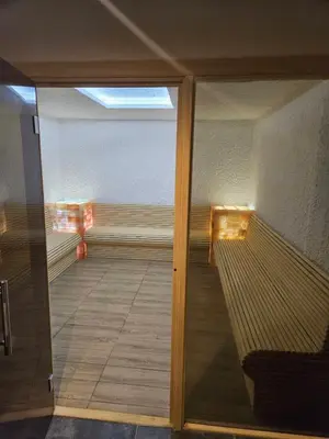 a view of a room with a glass door at Mokoš apartman, Residence hill A35, minimum dve noći in Kopaonik