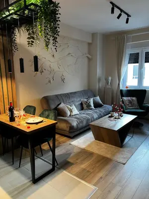 a living room with a couch and a table at Angelina Art in Trnava