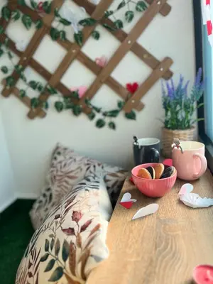a wooden table with a bowl of cookies on it at Angelina Art in Trnava
