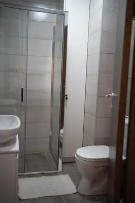 a bathroom with a toilet and a glass shower at Angelina Art in Trnava
