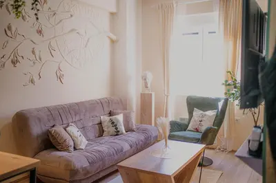 a living room with a couch and two chairs at Angelina Art in Trnava
