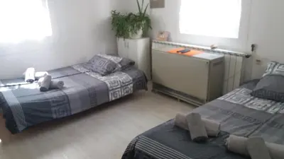 two beds in a room with at Apartman - kuca za odmor Slatina in Vrnjačka Banja