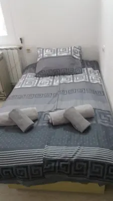 a pair of beds with pillows in a room at Apartman - kuca za odmor Slatina in Vrnjačka Banja