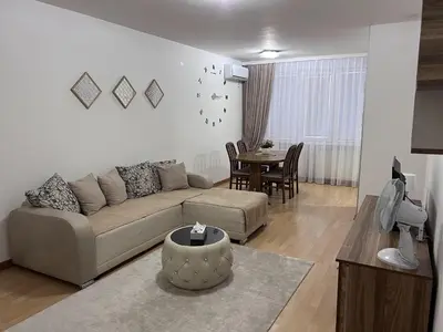 a living room with a couch and a table at Like home apartman in Paraćin