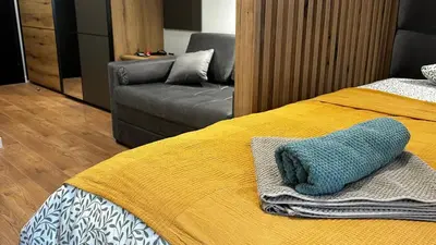 a bedroom with a bed with a blue pillow on it at Bela Reka C308 in Brzeće