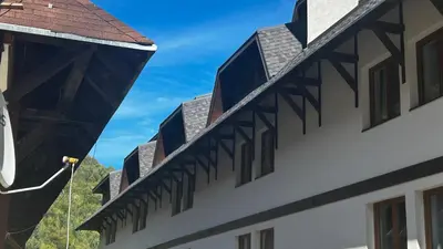 a view of the side of a building with windows at Bela Reka C308 in Brzeće
