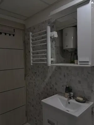 a bathroom with a sink and a mirror at La pera Kruševac in Kruševac
