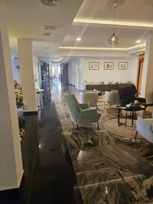 a lobby with couches and chairs in a building at Exclusive apartmants 1 Vrnjacka Banja in Vrnjačka Banja