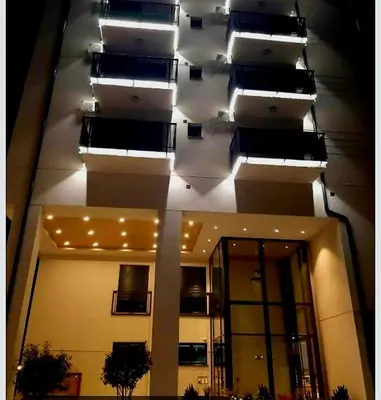 a building with lights on the side of it at Beril lux apartman in Jagodina