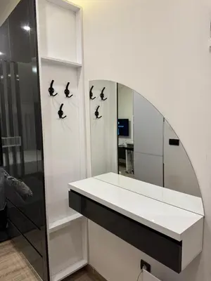 a dressing room with a mirror and birds on the wall at Residence Hill Kopaonik in Kopaonik