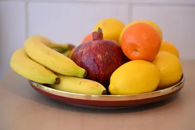 a bowl of fruit sitting on a table at Apartman Dunja in Kraljevo