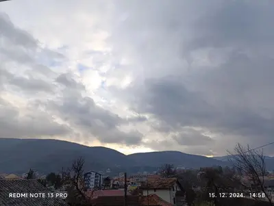 a cloudy sky with mountains in the background at Garfield Family Studio 1 in Soko Banja