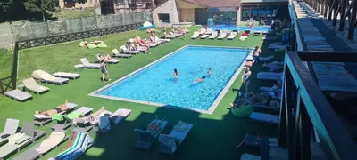 a group of people swimming in a swimming pool at Apartman Filipovic - Kraljevi Cardaci - Kopaonik in Kopaonik