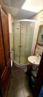 a bathroom with a glass shower and a sink at Vila Yeti Kopaonik in Kopaonik