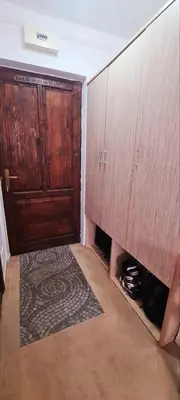 an empty room with a closet and a wooden door at Vila Yeti Kopaonik in Kopaonik