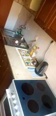 a kitchen counter with a stove and a sink at Smart 2 in Niš