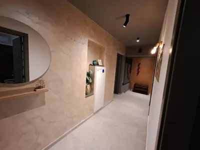 a room with a hallway with a refrigerator and a mirror at HILL Lux Apartman 1, FREE Secure private yard PARKING 2 place, DESIGNER home & WI-FI rooms & SMART TVx3 & 2 Bedroom & Rooms & Apartments Nis in Niš