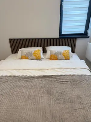 a large bed with two pillows on top of it at NORD VISTA Premium Alpine and SPA Experience in Kopaonik