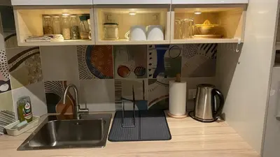 a kitchen with a sink and a counter top at Konaci Koznik Porodični in Kopaonik