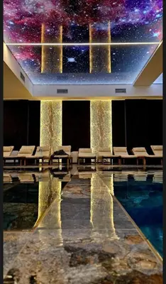 a room with a pool and a star ceiling at Fashion Residence Hill in Kopaonik