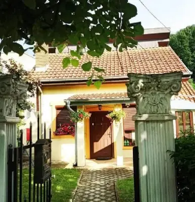 a house with a gate in front of it at V&Ž-Vb in Vrnjačka Banja