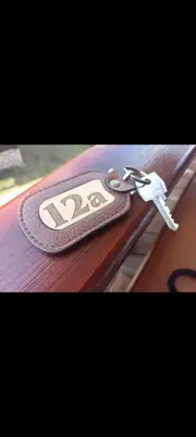 a pair of keys sitting on top of a table at V&Ž-Vb in Vrnjačka Banja