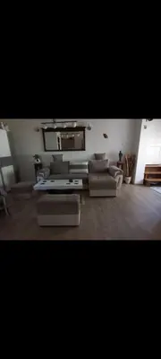 a living room with couches and a tv at V&Ž-Vb in Vrnjačka Banja