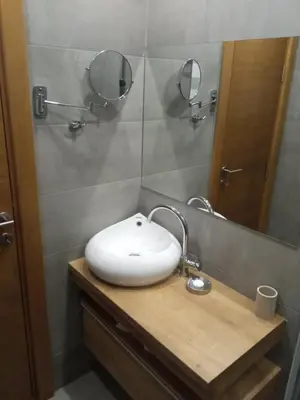 a bathroom with a sink and a mirror at Vila Barselona Kopaonik in Raška