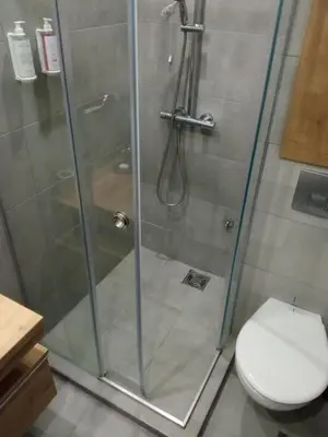 a shower stall with a toilet in a bathroom at Vila Barselona Kopaonik in Raška