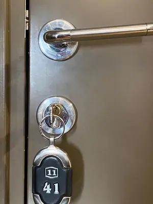 a metal door with a lock on it at LaKop Apartman in Kopaonik