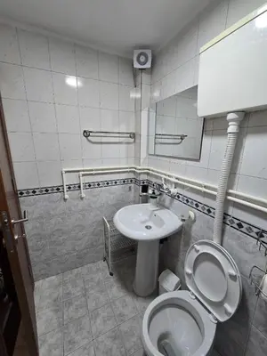 a bathroom with a toilet and a sink at Apartman Leda in Kopaonik