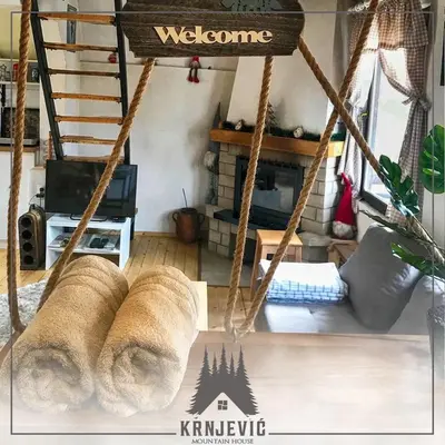 a swing with two loaves of bread in a living room at Vila Krnjević Jastrebac in Buci