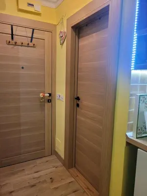 a wooden door in a room with yellow walls at Mina in Kopaonik