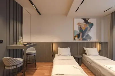 a hotel room with two beds and a bar at Planet Lux Apartment with secured parking In the garage in Niš