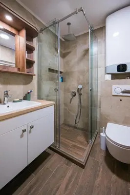 a bathroom with a shower and a toilet and a sink at Apartmani Jovičić Kopaonik in Kopaonik
