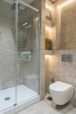 a bathroom with a glass shower and a toilet at Apartman Mimi Zepterme Vrnjačka Banja in Vrnjačka Banja